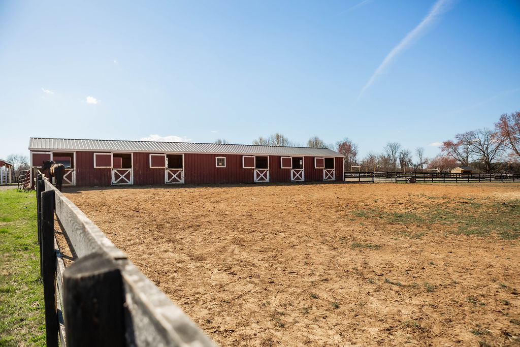 Serene Acres barn and arena from across the field
